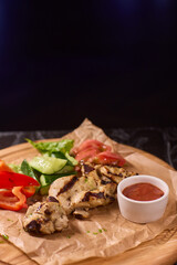 Deliciously Grilled Chicken Platter served alongside Fresh Colorful Vegetables and Sauce