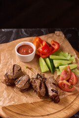 Indulge in a Delicious Grilled Steak Artfully Presented on a Wooden Serving Board