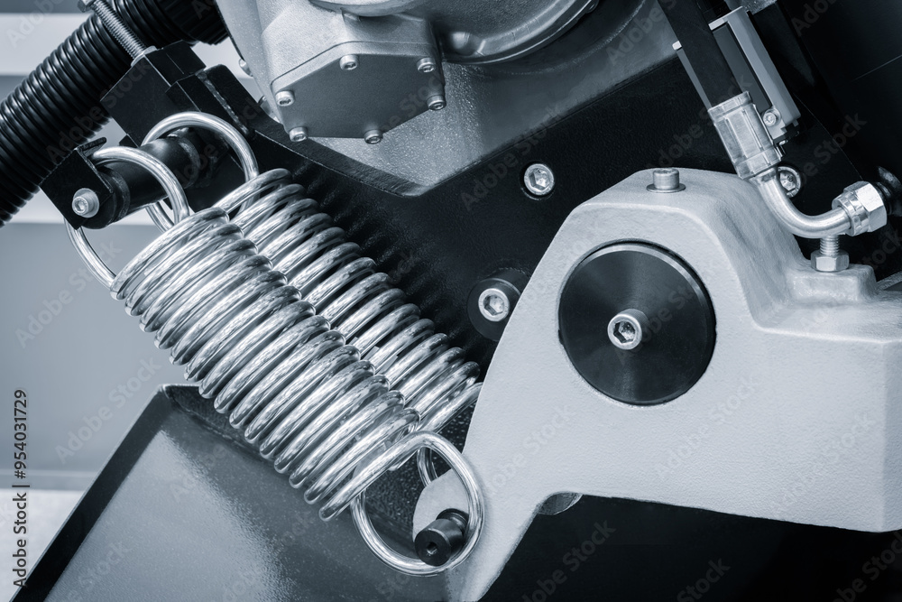 Poster a close up of a industrial mechanism with a spring attached to it, industrial concept background