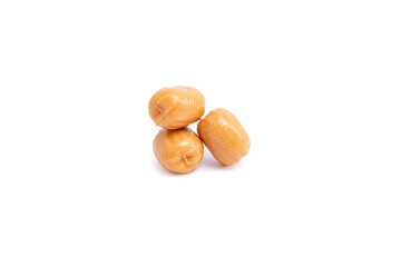 Three caramel candy drops piled up isolated on white background