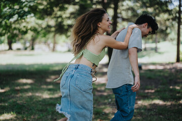 Fototapeta premium Two young teenagers playfully interacting in a park, exhibiting genuine friendship, joy, and moments of laughter.