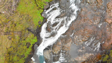 Aerial view of beautiful Stjornarfoss waterfall on a wet rainy day