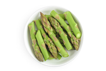 fresh asparagus in ceramic bowl isolated on white background. Top view. Flat lay.