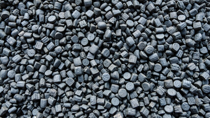 Recycled rubber granules from discarded vehicle tires for athletic Generative AI