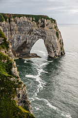 West coast of France. Clifs of Etreta. Rocks on the coast of the English channel strait. Etretat village, Normandy region.