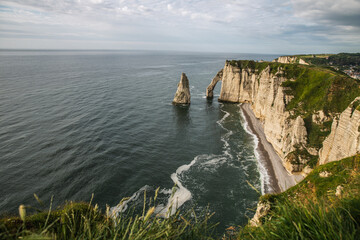 West coast of France. Clifs of Etreta. Rocks on the coast of the English channel strait. Etretat village, Normandy region.