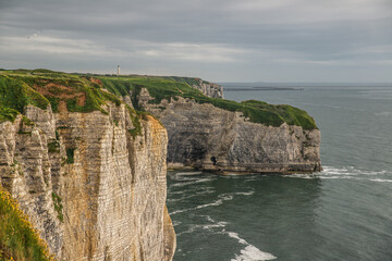 West coast of France. Clifs of Etreta. Rocks on the coast of the English channel strait. Etretat village, Normandy region.