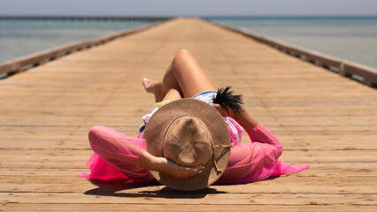 young woman relaxing on the beach
