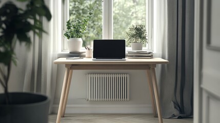 A Danish architects desk with a laptop and simple clean design