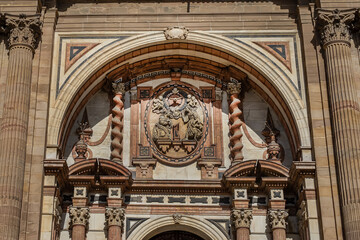 Obraz premium Architectural fragments of Malaga Cathedral facade. Renaissance Cathedral - Roman Catholic Church in the city of Malaga, was constructed between 1528 and 1782. Malaga, Costa del Sol, Andalusia, Spain.