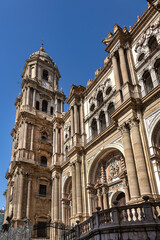 Fototapeta premium Architectural fragments of Malaga Cathedral facade. Renaissance Cathedral - Roman Catholic Church in the city of Malaga, was constructed between 1528 and 1782. Malaga, Costa del Sol, Andalusia, Spain.