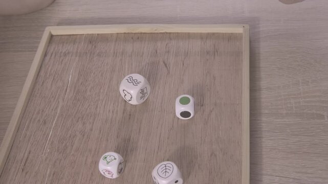child, toddler early math skills, rolling wooden dice and learning about symbols, Back to school preparations, patterns through playful exploration with wooden blocks