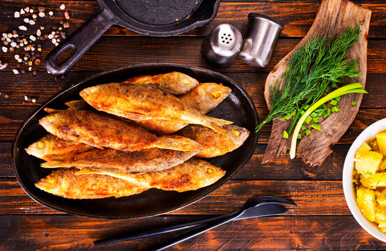 Plate of fried fish, fried fish and potato