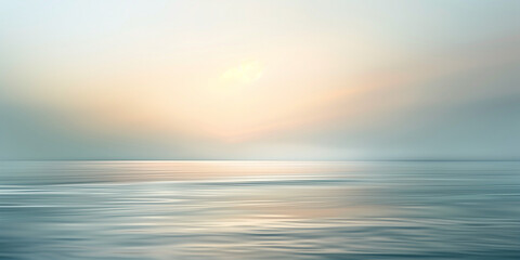 Obraz premium Serene Seascape with Low-Hanging Sun Casting Warm Glow Over Calm Water at Sunrise or Sunset.