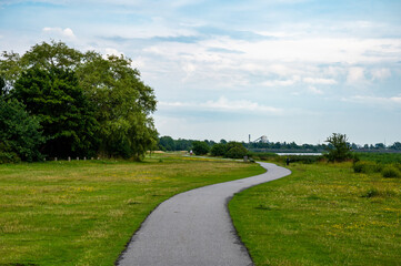 Empty asphalt cycling path at the Brondby strandpark, Copenhagen, Denmark