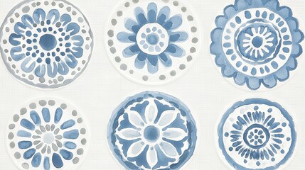   A set of blue and white dishes on a white table with blue and white blossoms and specks