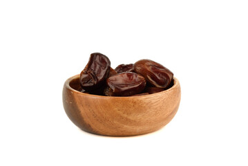 Wooden bowl with dry dates on white background.