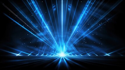 Fototapeta premium A vibrant blue light burst with rays and particles, creating a dynamic visual effect.
