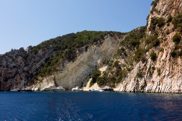 Amazing scenery by the coastline in Kastos island, Greece, with yachts and boats
