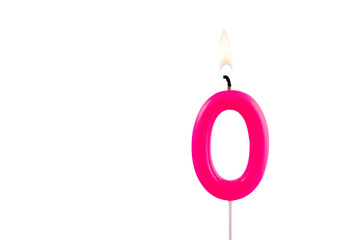 Pink number 0 birthday candle on white background