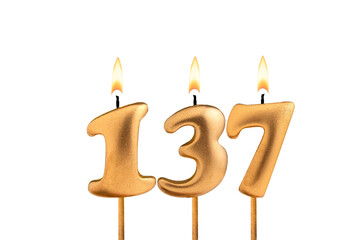 Birthday number 137 - Golden candle on white background