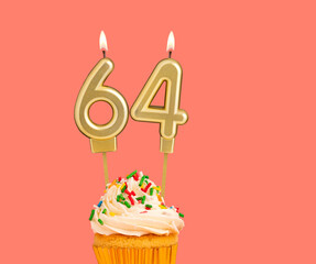 Birthday number 64 - Golden candle with cupcake