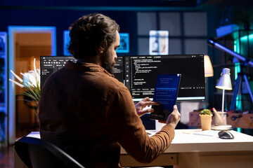 Programmer using tablet to fix vulnerabilities in software enabling attackers to compromise systems. Man taking care of security exposures in operating system, writing code on device