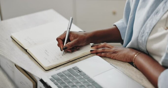 Black woman, hands and writing notes in book for agenda, laptop and remote work schedule in home. African entrepreneur, computer and diary for planning online course, translation service and research