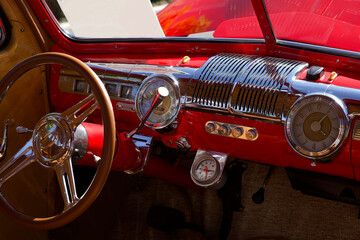 classic car interior view of dashboard and front seat