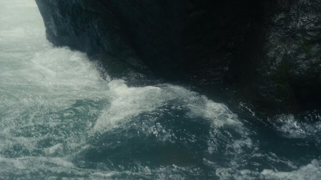 Slow Motion close up of water rushing in a tropical rainforest jungle
