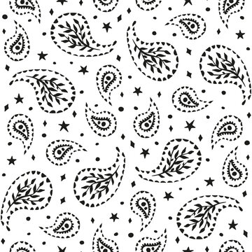Black and white seamless pattern with celestial and paisley motifs. Monochrome stars and florals boho wallpaper.