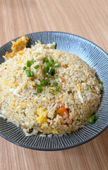 Seafood fried rice with shrimp and egg on a table