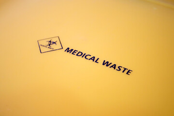 Medical waste bin. Biohazard contaminated waste sign trash garbage bin.