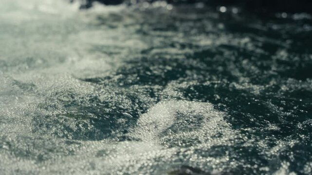 Slow Motion close up of water rushing in a tropical rainforest jungle