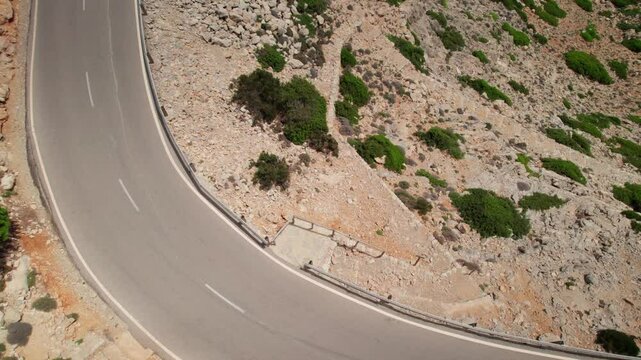 Serpentine mountain curving roads from above drone aerial