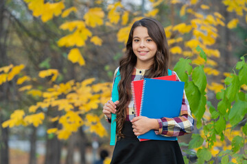 Back to school. Education and knowledge. School education. Student girl do homework in autumn. Autumn time to study. School girl get knowledge outdoor. Knowledge day. Autumn day. Fall season