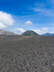 Naklejka premium Volcanic scree, Bromo Tengger Semeru National Park including farm land in the foreground.