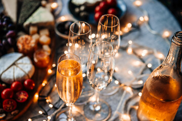 Glasses of sparkling wine or champagne served on the table for Christmas or New Year eve celebration.