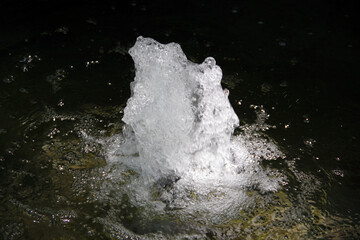 Bubbling water in a fountain pond
