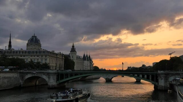 Sunset View of the Seine River and Historic Bridge in Paris. A serene evening shot of the Seine River in Paris, showcasing a historic bridge and the stunning sunset sky

