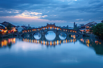 Fototapeta premium Chinese ancient town at night, ancient stone bridges and residential buildings