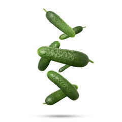 Whole ripe cucumbers falling on white background