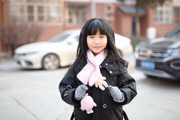 Chinese little girl playing outdoors