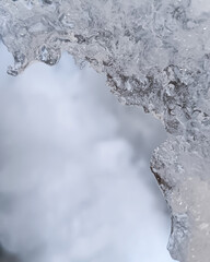 Ice frame on light blurred background and copy space.