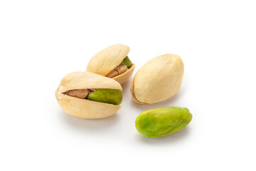 The pistachios are lying on a white surface. Peeled kernels of nuts. Unpeeled kernels of nuts. Pistachios isolated on white background.