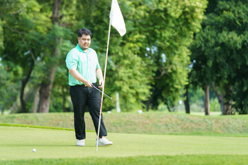 Man is playing golf in morning.