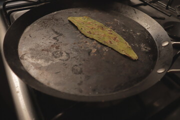 Preparing and roasting a green spineless cactus, for a healthy and balanced diet.