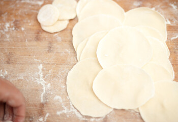 Rolling dumpling wrappers