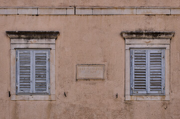 A shuttered window on a building in Jelsa Town, on Hvar Island, Croatia