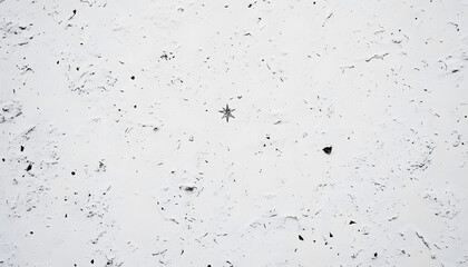 A mostly blank background with a small, centered design, like a tiny star or dot, emphasizing simplicity and space